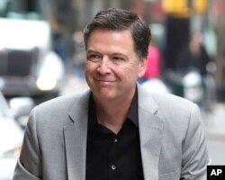 Former FBI director James Comey arrives for an appearance on "The Late Show with Stephen Colbert" at the Ed Sullivan Theater, April 17, 2018, in New York.