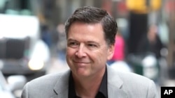 Former FBI director James Comey arrives for an appearance on "The Late Show with Stephen Colbert" at the Ed Sullivan Theater, April 17, 2018, in New York. 