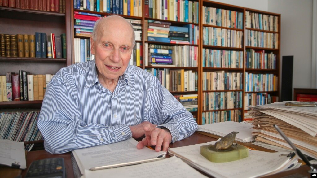 Manfred Steiner, who earned his Ph.D. in physics from Brown University at the age of 89, is photographed in his home office in East Providence, R.I., Wednesday, Nov. 10, 2021. (AP Photo/Stew Milne)