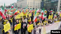 People demonstrate in front of the Brandenburg Gate to support protests across Iran, in Berlin, Germany, Jan. 6, 2018.