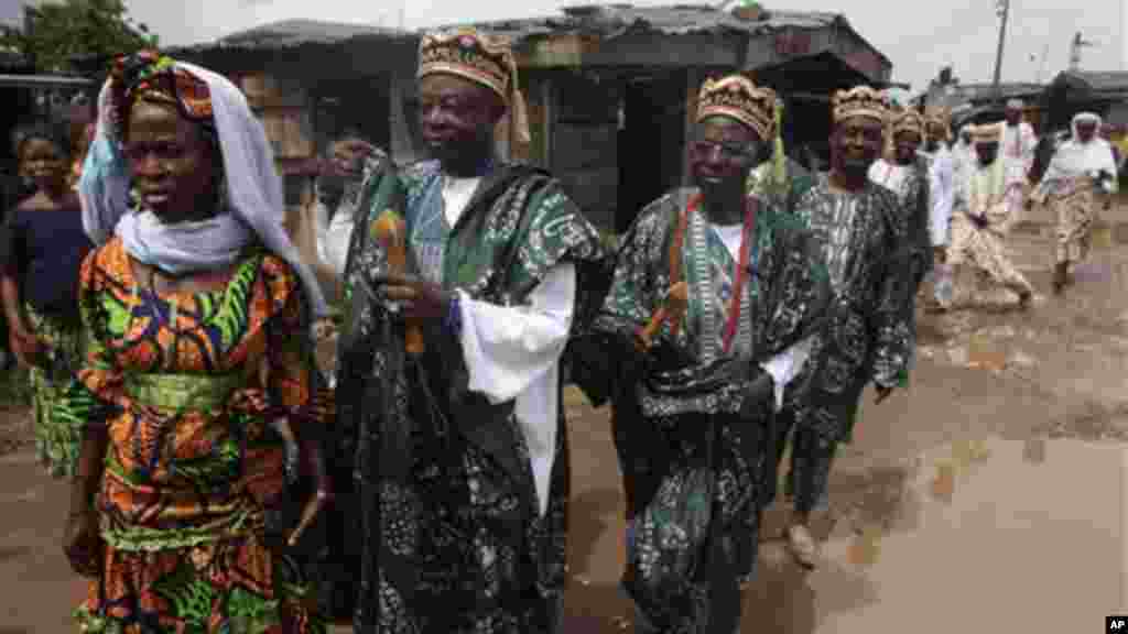 Traditional rulers prepare to greet visitors in Ijoko, Nigeria.