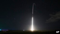 FILE - This photo shows the launch of the U.S. military's land-based Aegis missile defense testing system, that later intercepted an intermediate range ballistic missile, from the Pacific Missile Range Facility on the island of Kauai in Hawaii, Dec. 10, 2018.