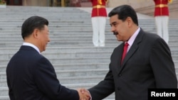 中国国家主席习近平2018年9月14日在北京欢迎到访的委内瑞拉总统马杜罗。