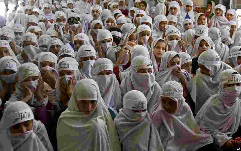 Afghan girls attend their graduation ceremony at the Pir Massoudia Islamic madrassa in Kandahar province south of Kabul.