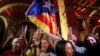 People react to results in Catalonia's regional elections at a gathering of the Catalan National Assembly in Barcelona, Spain, Dec. 21, 2017. 