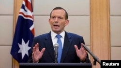 Australian Prime Minister Tony Abbott speaks during a press conference at a hotel in Beijing, China, April 12, 2014.