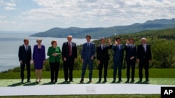 FILE - G-7 summit participants pose for a family photo, in Charlevoix, Canada, June 8, 2018, 