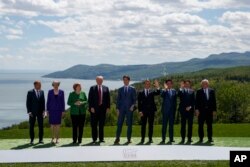 FILE - G-7 summit participants pose for a family photo in Charlevoix, Canada, June 8, 2018.