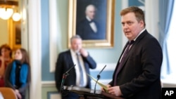 FILE - Iceland's Prime Minister Sigmundur David Gunnlaugsson speaks during a parliamentary session in Reykjavik, April 4, 2016. He resigned Wednesday under pressure from thousands of protesters after documents linked him and his wife to shady financial dealings.