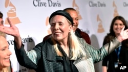 FILE - Joni Mitchell arrives at the 2015 Clive Davis Pre-Grammy Gala in Beverly Hills, Calif. Feb. 7, 2015.