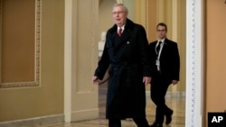 Senate Majority Leader Mitch McConnell of Ky. arrives on Capitol Hill in Washington, Jan. 24, 2019. 