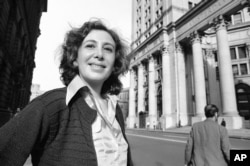 FILE - Susan Brownmiller is shown on the streets of lower Manhattan in New York, Oct. 18, 1975.