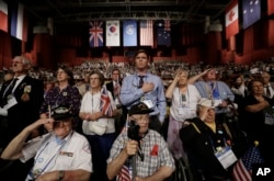 Foreign veterans of the Korean War and their family members salute during a commemorative ceremony marking the 63rd anniversary of the Armistice Agreement and UN Forces Participation in the Korean War in Seoul, South Korea on July 27, 2016.