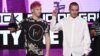 Josh Dun, left, and Tyler Joseph, of Twenty One Pilots, accept the award for favorite duo or group - pop/rock at the American Music Awards at the Microsoft Theater, Nov. 20, 2016, in Los Angeles.