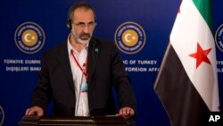 Outgoing Syrian opposition leader Moaz al-Khatib speaks during a news conference after a Friends of Syria group meeting at the Adile Sultan Palace in Istanbul, Turkey, April 21, 2013.