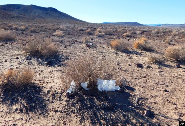 This undated photo provided by the U.S. National Park Service shows toilet paper strewn throughout Death Valley National Park, Calif. National parks across the United States are scrambling to clean up and repair damage caused by visitors and storms during