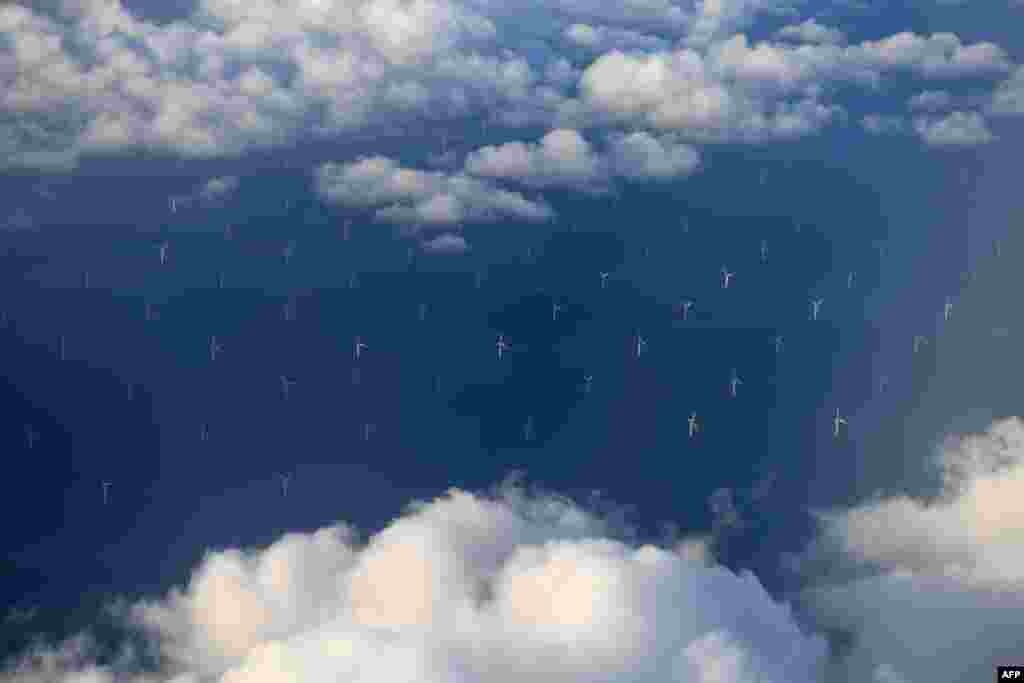 Burbo Bank Offshore Wind Farm on the Burbo Flats in Liverpool Bay, operated by DONG Energy, is pictured from the the window of an aircraft flying over the Irish Sea, off the west coast of northern England.