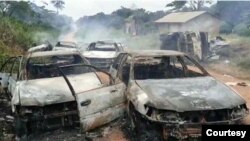 FILE: In a previous incident, ADF fighters burned a convoy of cars in Mafifi village, Irumu territory, Ituri, DRC, on Sept. 1st 2021.
