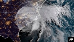This satellite image provided by NOAA shows Hurricane Florence on the eastern coast of the United States early Saturday, Sept. 15, 2018. (NOAA via AP)