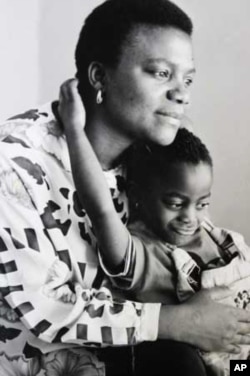Bernice, as a toddler, in the arms of her mother. Her mother unwittingly transmitted HIV to her, probably during childbirth