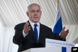 Israeli Prime Minister Benjamin Netanyahu gestures as he delivers a speech during a ceremony commemorating the 75nd anniversary of the Vel d'Hiv roundup, July 16, 2017 in Paris.