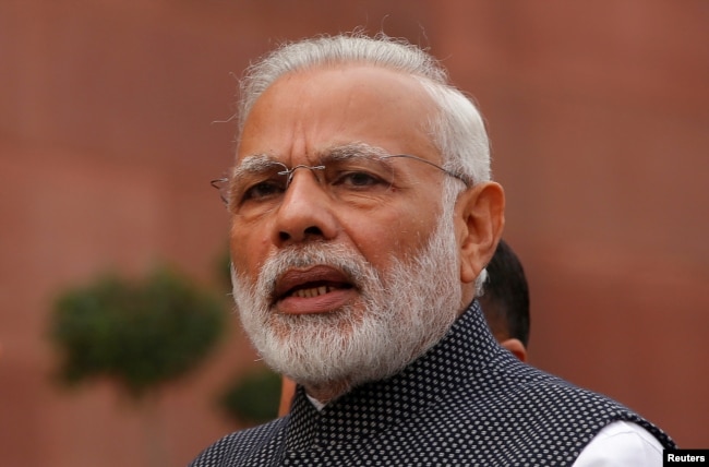 FILE - India's Prime Minister Narendra Modi speaks to the media inside the parliament premises in New Delhi.
