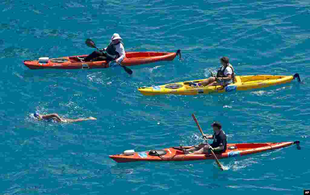 This photo provided by the Florida Keys News Bureau, shows Diana Nyad, positioned about three kilometers off Key West, Florida, Sept. 2, 2013.