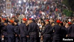 Police officers secure Jordan's Prime Minister's office during a protest in Amman, Jordan, June 2, 2018.