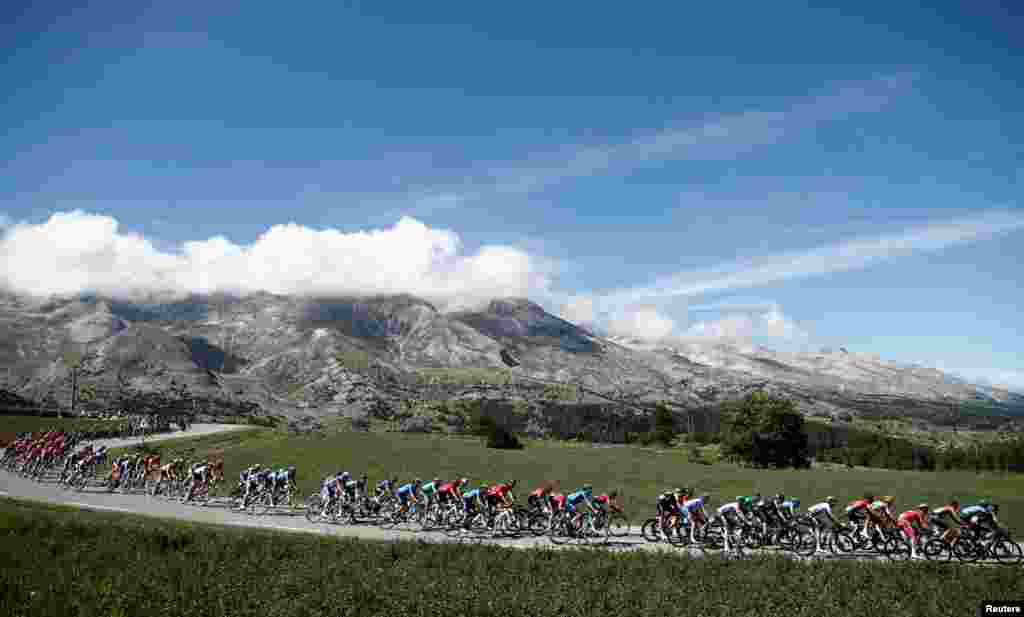 The peloton rides during the fourth stage of the Tour de France cycling race over 160,5 kilometers (99,7 miles) with start in Sisteron and finish in Orcieres-Merlette, southern France.