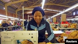 FILE: A woman works at a clothing factory at the industrial town of Newcastle, 260 km southeast of Johannesburg, May 8, 2013.