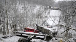 A Port Authority bus that was on a bridge when it collapsed Jan. 28, 2022, is visible in Pittsburgh's East End.