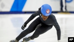 Maame Biney competes in the women's 500-meter race during the U.S. Olympic short track speedskating trials, Dec. 16, 2017, in Kearns, Utah.