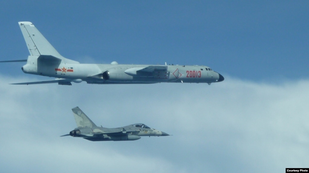 FILE - A Taiwanese fighter jet flew close to a Chinese H-6 bomber in 2017.