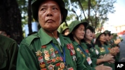 Vietnamese veterans gather for a parade celebrating the 40th anniversary of the end of the Vietnam War which is also remembered as the fall of Saigon, in Ho Chi Minh City, Vietnam, Thursday, April 30, 2015.