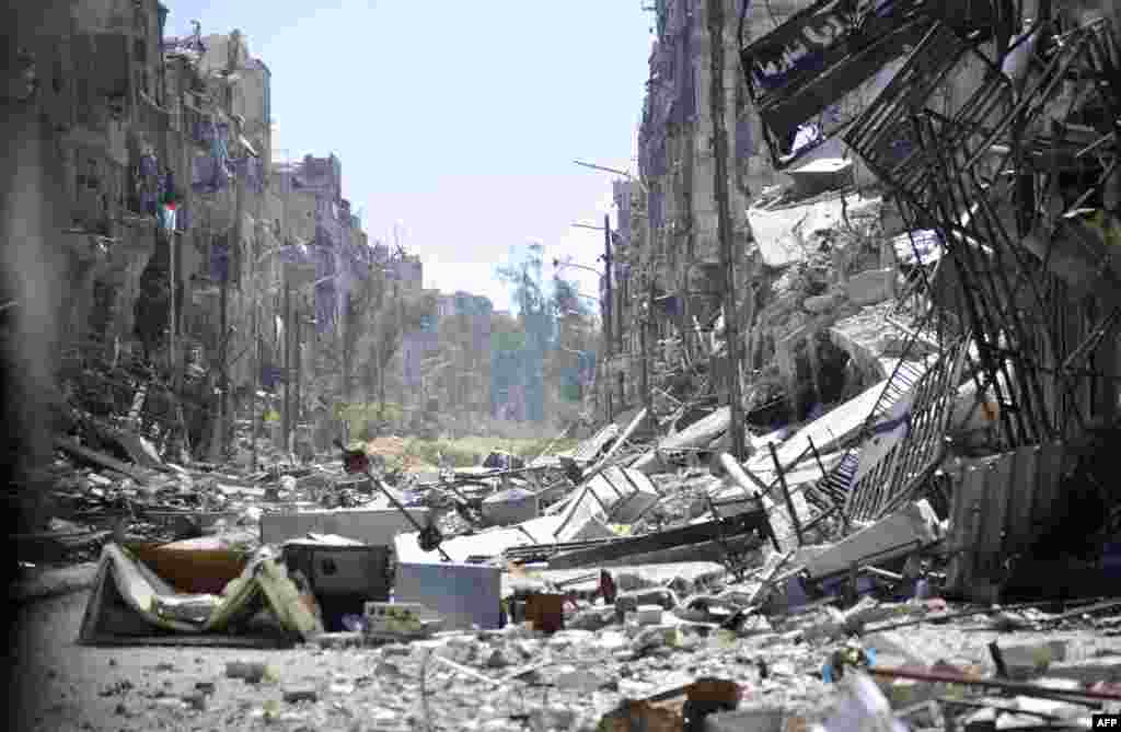 A general view shows destruction in Yarmuk Palestinian refugee camp in the Syrian capital, Damascus. Around 2,000 people have been evacuated from the refugee camp after the Islamic State group seized large parts of it, a Palestinian official told AFP.