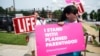 Pro-choice and pro-life protesters stand outside of Planned Parenthood as a deadline looms to renew the license of Missouri's sole remaining Planned Parenthood clinic in St. Louis, Missouri, May 31, 2019. 
