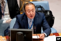 FILE - Zhang Jun, permanent representative of China to the United Nations, speaks during a meeting of the Security Council, Sept. 23, 2021, in New York.