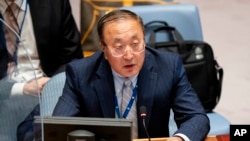 FILE - Zhang Jun, permanent representative of China to the United Nations, speaks during a meeting of the Security Council, Sept. 23, 2021, in New York.