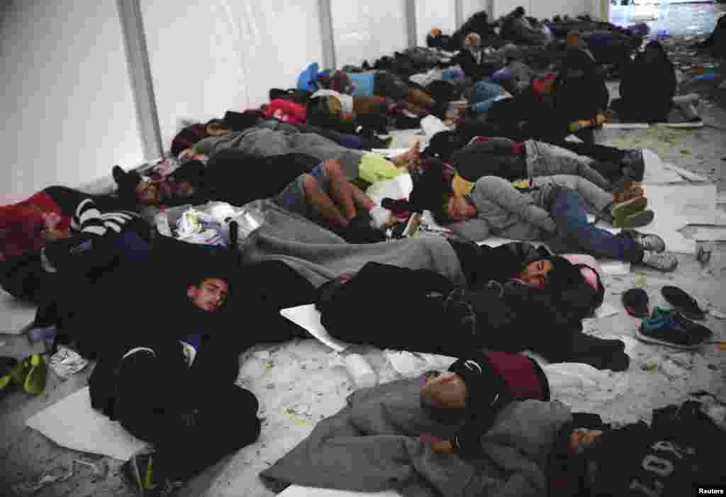 Migrants sleep at transit camp in Gevgelija, Macedonia, after entering the country by crossing the border with Greece. A tide of refugees from the Middle East and Asia showed no sign of abating, after European Union leaders began the task of trying to prevent tens of thousands of people fleeing war or poverty from streaming unchecked through the continent.