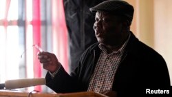 FILE: Zimbabwe's Prime Minister Morgan Tsvangirai gestures during a media briefing in Harare, August 1, 2013.