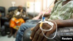 FILE: Cancer patients sit in a chemotherapy ward while receiving treatment at the Korle Bu Teaching Hospital in Accra. Taken April 24, 2012.