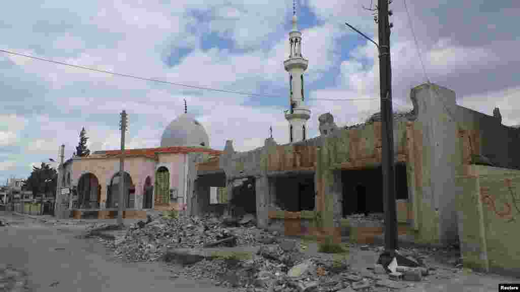 Damaged mosques and properties activists said were hit by shelling by forces loyal to Syria&#39;s President Bashar al-Assad, in Daraa, April 10, 2013.