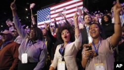 Supporters of President Barack Obama react to favorable media projections at the McCormick Place during an election night watch party in Chicago, Tuesday, Nov. 6, 2012.