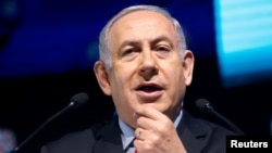 Israeli Prime Minister Benjamin Netanyahu speaks during the Muni World 2018 conference in Tel Aviv, Israel, Feb. 14, 2018. 