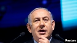 FILE - Israeli Prime Minister Benjamin Netanyahu speaks during the Muni World 2018 conference in Tel Aviv, Israel, Feb. 14, 2018. 