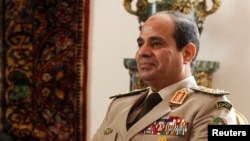 FILE - Egypt's Army Chief General Abdel Fattah al-Sisi at El-Thadiya presidential palace in Cairo, Nov. 14, 2013