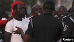 Supporters of presidential candidate Nana Akufo-Addo of the opposition New Patriotic Party (NPP) protest at the electoral commission in Accra December 9, 2012.