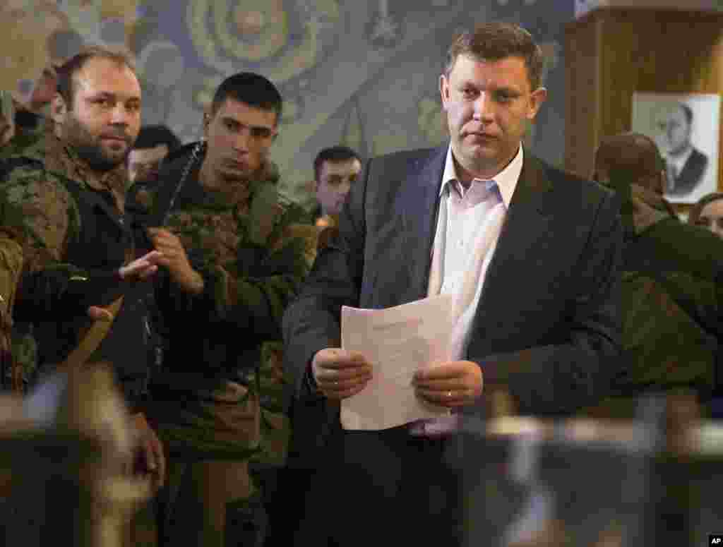 Pro-Russian rebel leader Alexander Zakharchenko prepares to cast his ballot in elections held by pro-Russian separatists, Donetsk, Nov. 2, 2014. 