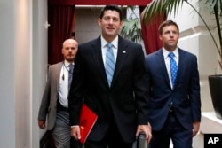 House Speaker Paul Ryan of Wisconsin, center, arrives for a meeting with House Republicans, Sept. 6, 2017, on Capitol Hill in Washington.