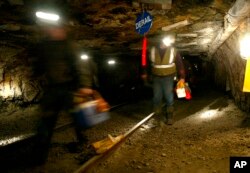 FILE - Ohio coal miners head into the mine for a shift inside the Hopedale Mine near Cadiz, Ohio, March 10, 2006.